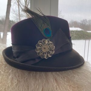 Fedora hat with peacock feather